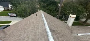 Crew working on shingle installation for roof replacement in Hillsborough County