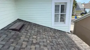 Crew installing new roofing system on a Riverview house