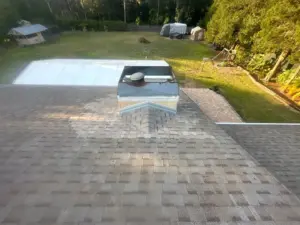 Roofing crew sealing a repaired section on a Wesley Chapel home