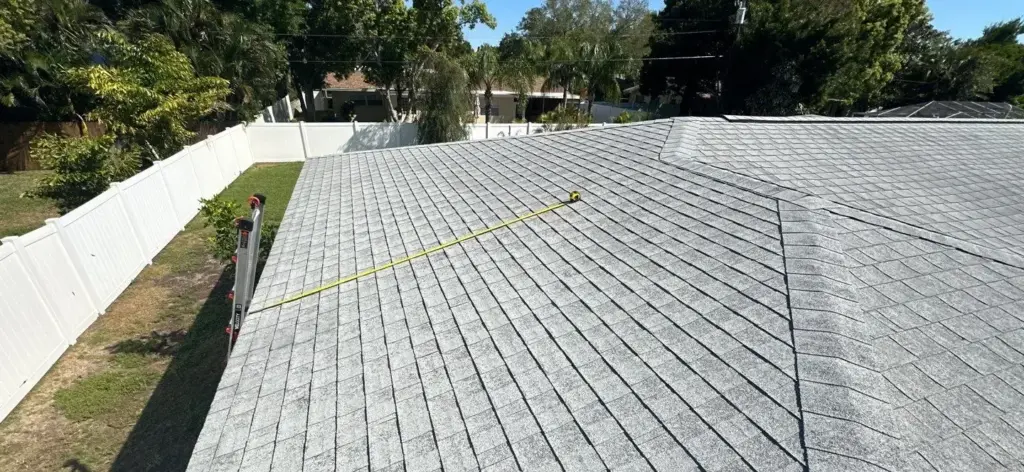 Crew performing a roof repair on a Clearwater home
