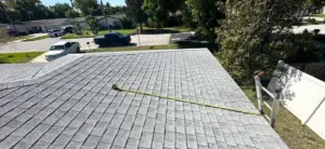 Close-up of shingle and flashing repair work on a Clearwater roof