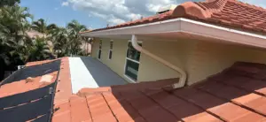 Ridge cap and flashing detail on a completed tile roof in Hillsborough County