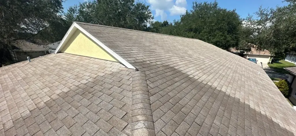 Crew inspecting roof section during repair job in Riverview, FL