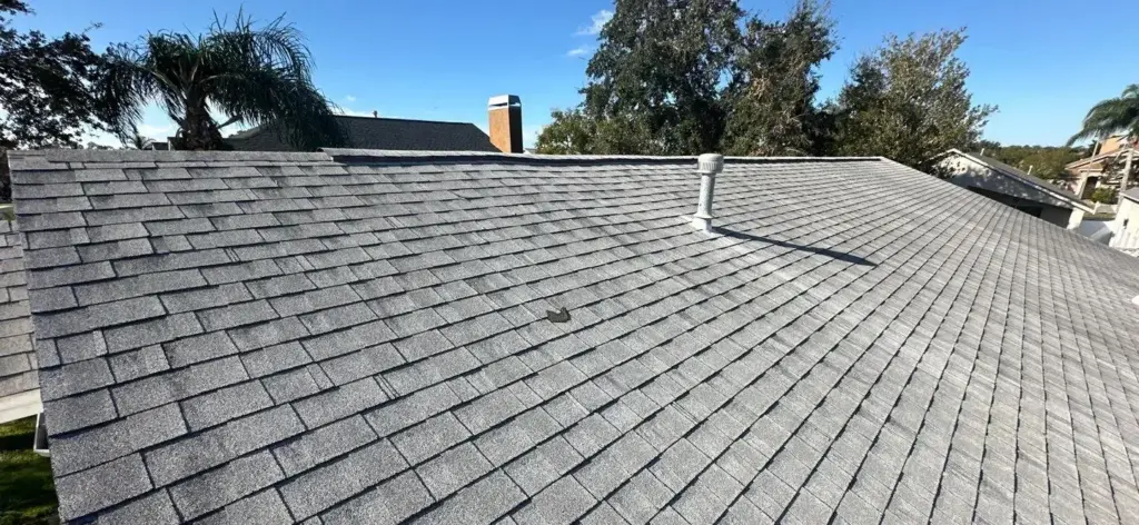 Crew inspecting decking during a roof repair in Lutz
