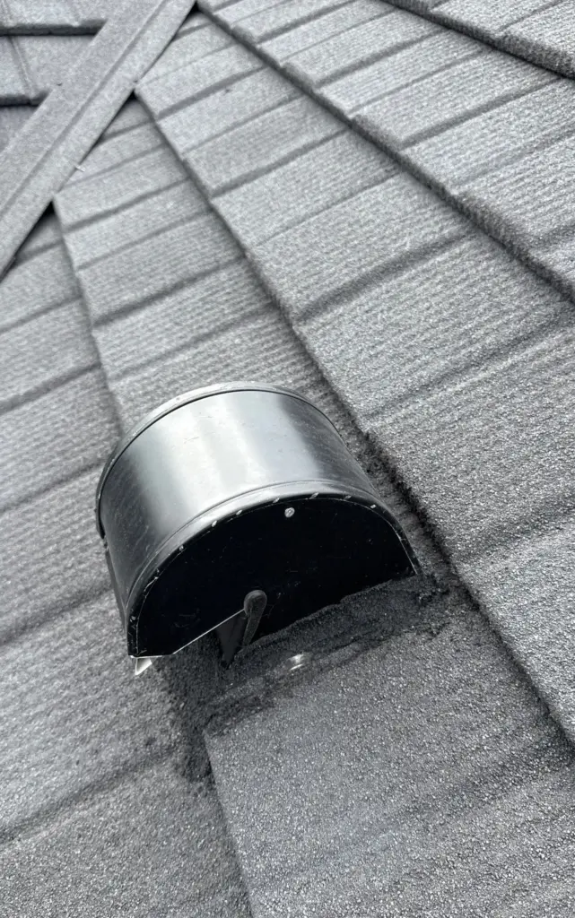 Commercial roof repair crew inspecting flashing on a St. Petersburg building