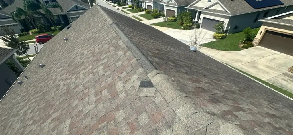 Crew performing roof repair work on a home in Riverview, FL