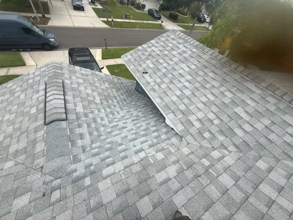 Crew inspecting roof repair site in Pinellas County