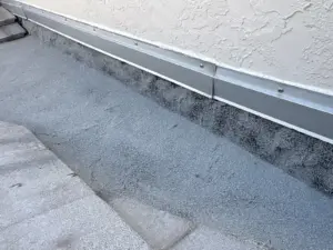 Crew setting tile courses during a roofing job in Hillsborough County