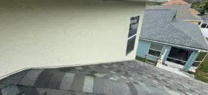 Crew installing new shingles during a roof replacement in Lutz