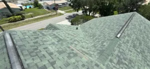 Crew installing new shingles on a roof replacement job in Pinellas County